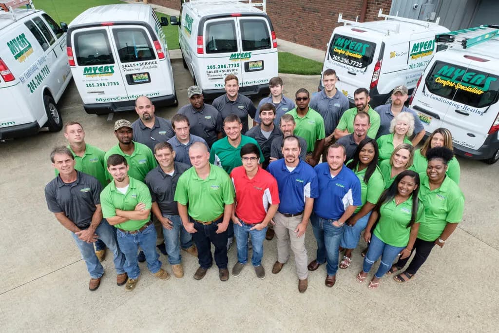 The Myers Comfort Specialists team with their service fleet